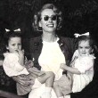 1949. With twins Cathy and Cynthia.