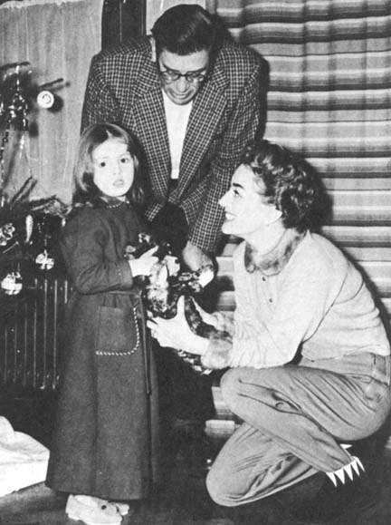 Christmas Eve, 1955. With writer Paul Gallico and daughter.