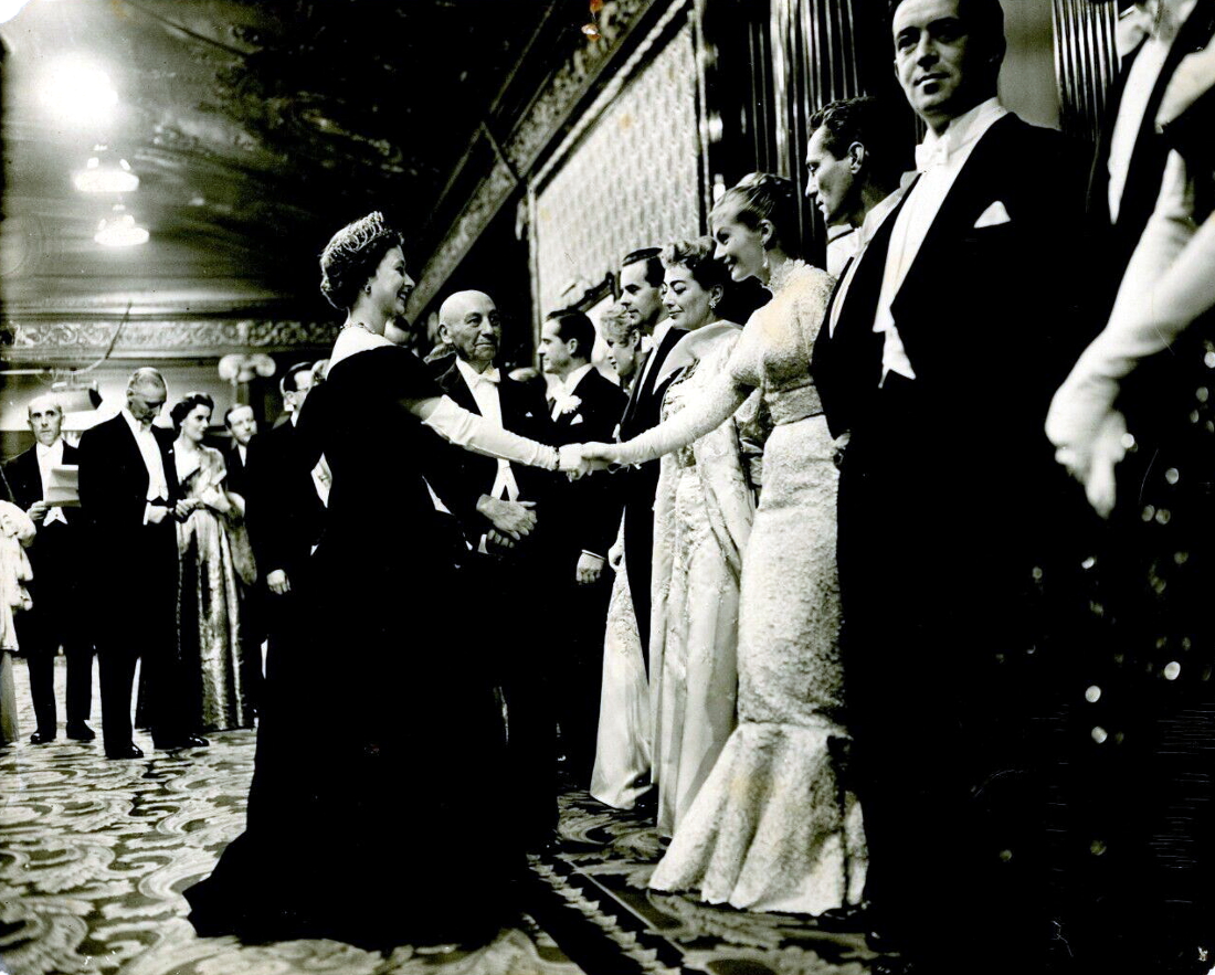 10/29/56. At the Royal Film Performance with QEII, Anita Ekberg, Peter Finch, et al.