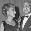 At the 4/5/65 Oscars with Best Director George Cukor. (Joan presented him with his award during the show.) Thanks to Bryan Johnson.