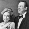 Golden Globes, 2/3/70. With John Wayne after he presented her with the Cecil B. DeMille Award. Includes press caption.