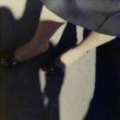 Two shots of Joan's legs/shoes by Peter Warrack.