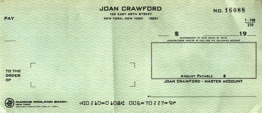 A personal check from Joan's last address on E. 69th St.