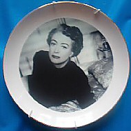 A plate, 8 inches in diameter, with 24k gold rim. EBay auction 9/04, with the description: 'Will look great on your Bitch of a Bearing Wall!'