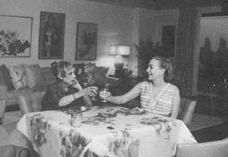A living room shot, with friend Anita Loos.