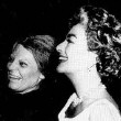 May 1963. Joan delivers Oscar to Anne Bancroft on the set of Bancroft's Broadway show, 'Mother Courage and Her Children.'