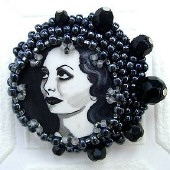 A beaded Joan brooch by Sherri Leeder.